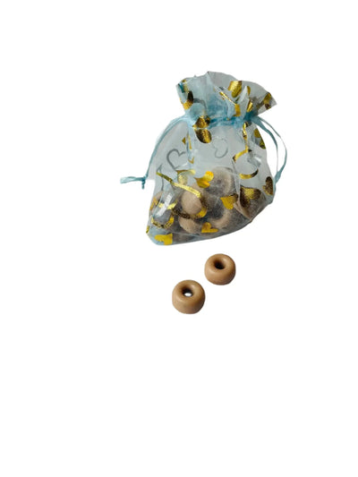 Sheer blue bag with gold accents containing mini wax melts, two wax melts displayed in front.