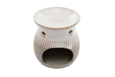 Grey sandstone oil/wax burner with a textured base and smooth top, featuring an open cavity for a tea light.
